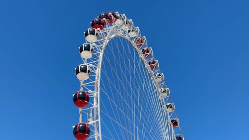 An Observation Wheel against a Blue Sky