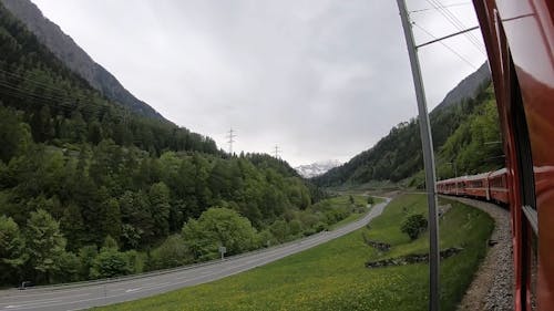 A Mountain Landscape Seen from a Moving Train Window 