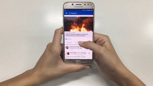 Person Scrolling A Samsung Smartphone 