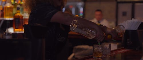 A Bartender Pouring Drinks