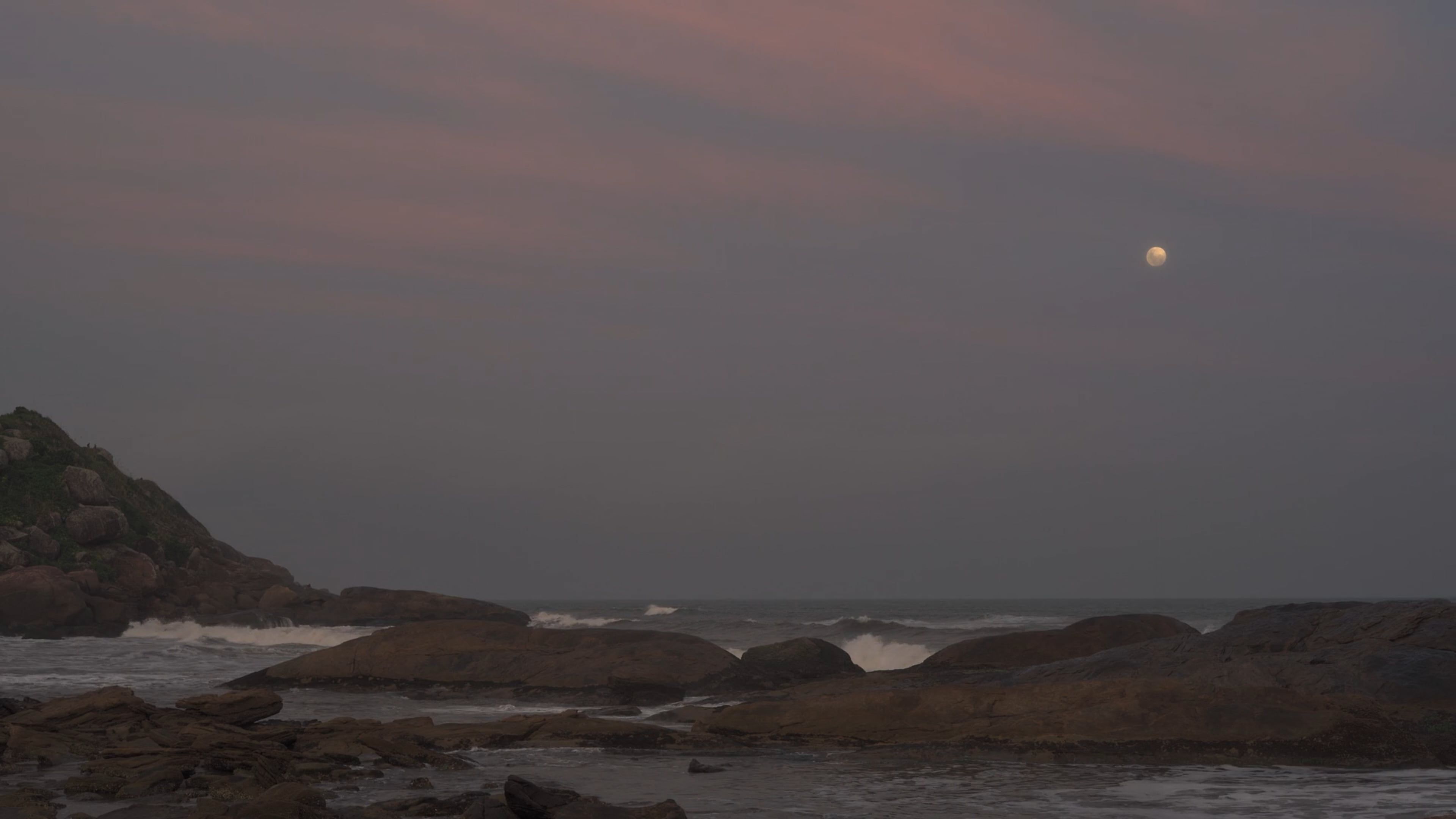 Full moon seen from a rocky beach at nightfall Free Stock Video Footage ...