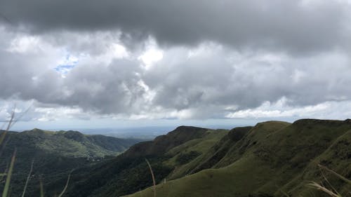 Time Lapse of Moving Clouds over a Mountain Area 