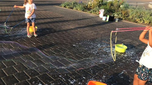 Children Playing With Bubbles