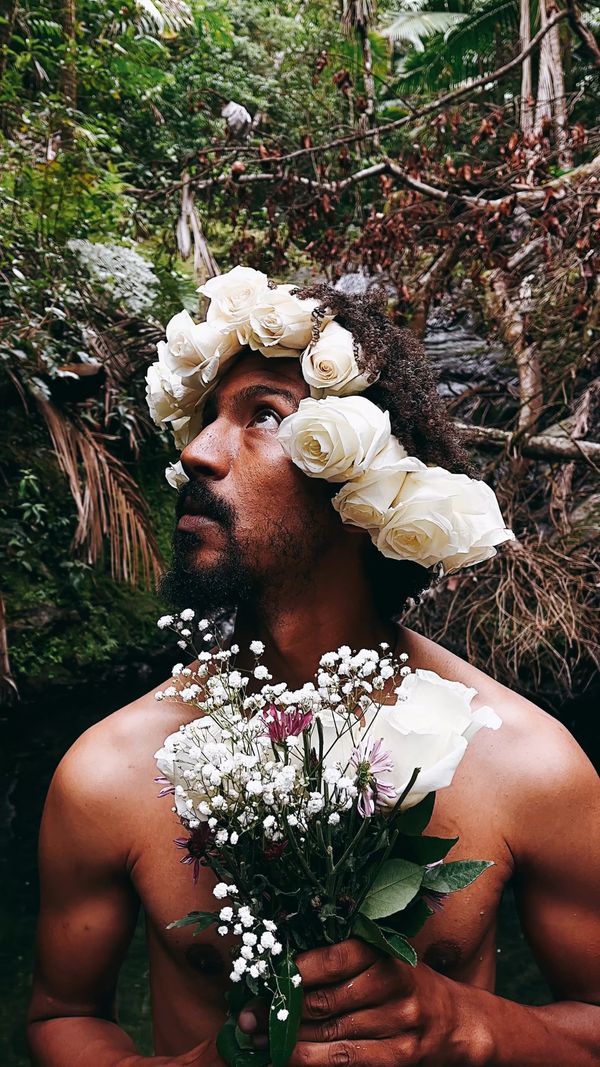 A Shirtless Man Posing with Flowers in his Hair Free Stock Video ...