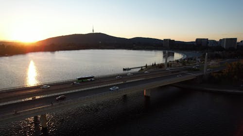 Drone Video of Vehicles Crossing a Bridge at Sunset 