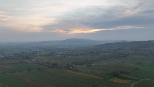 Drone Footage of a Rural Area under a Cloudy Sky 