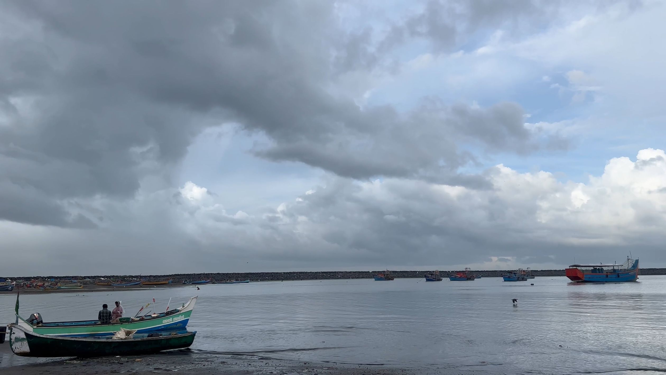 A boat is docked in the water under a cloudy sky Free Stock Video ...