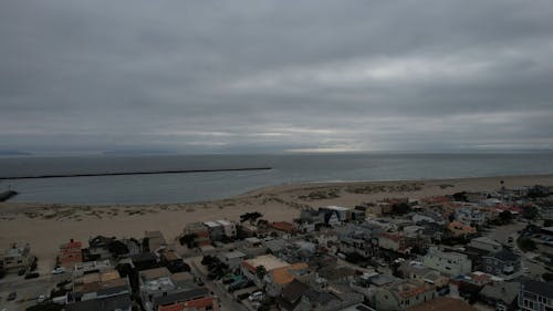 Drone Footage of a Coastal Area under a Grey Sky 
