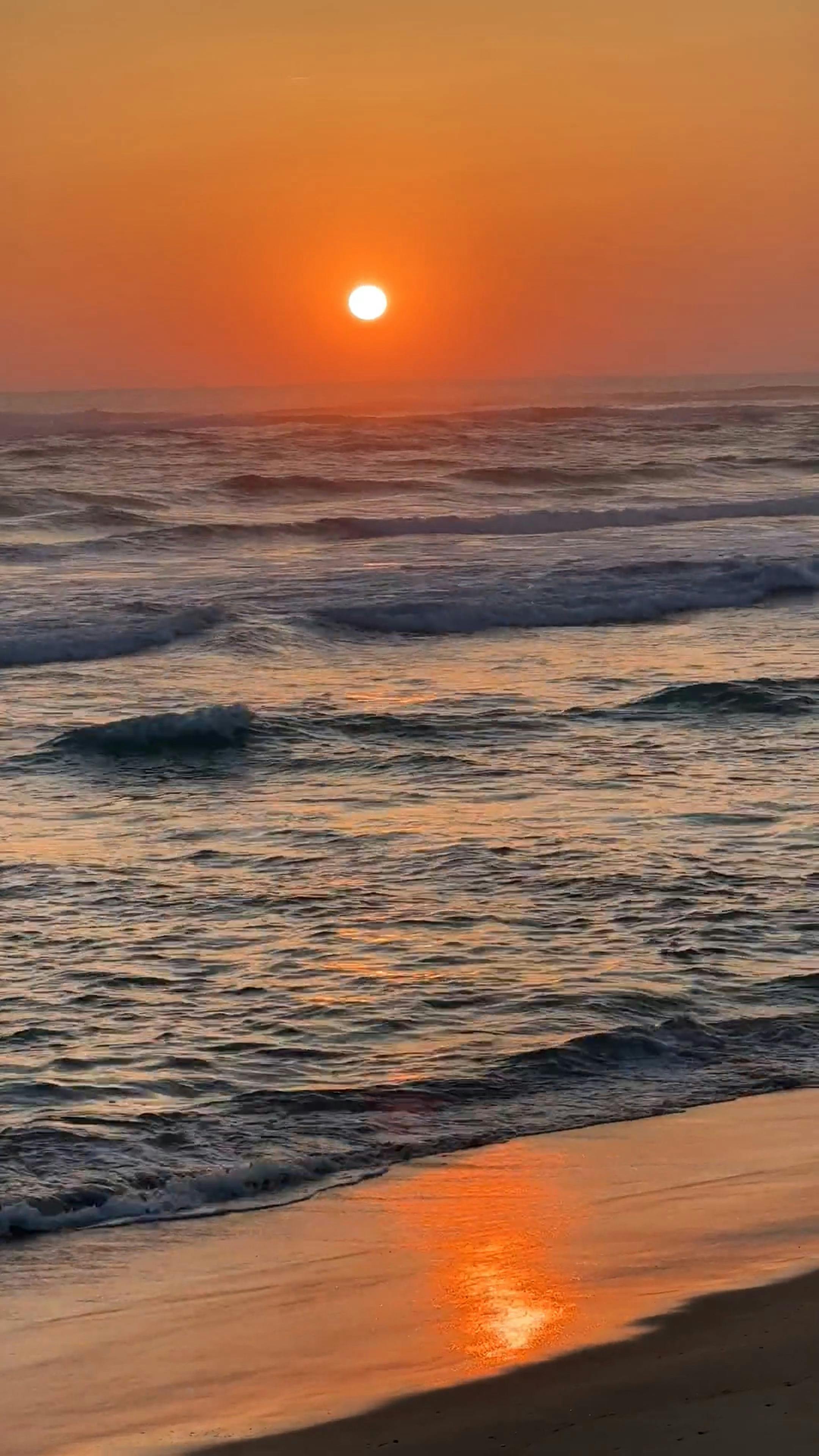 the sun is setting over the ocean with the words the sun is setting 17303613