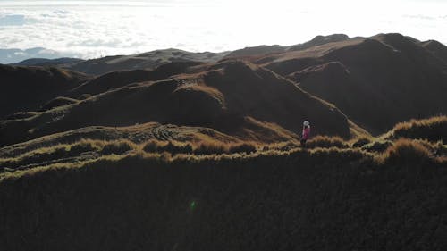 Aerial view of Mountain with Woman Walking