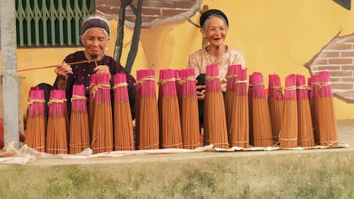 Elderly Women Selling Incense Sticks in the Street 