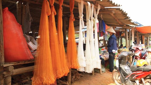 A Customer at a Vietnamese Market Stall 