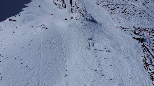 Aerial Footage of a Ski Center on a Snow Covered Mountain 