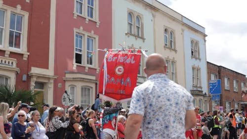 Bristol Samba waving flag at St Pauls Carnival 2023