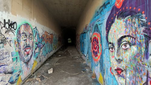 Portraits in  tunnel next to the beach