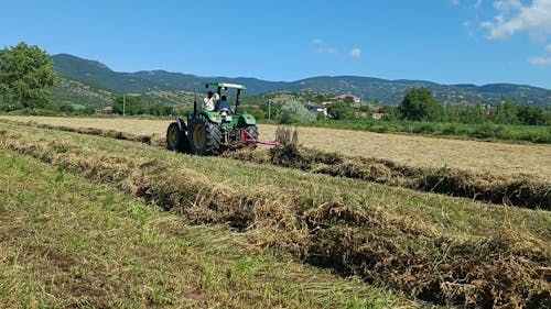 A Tractor Plowing a Field 
