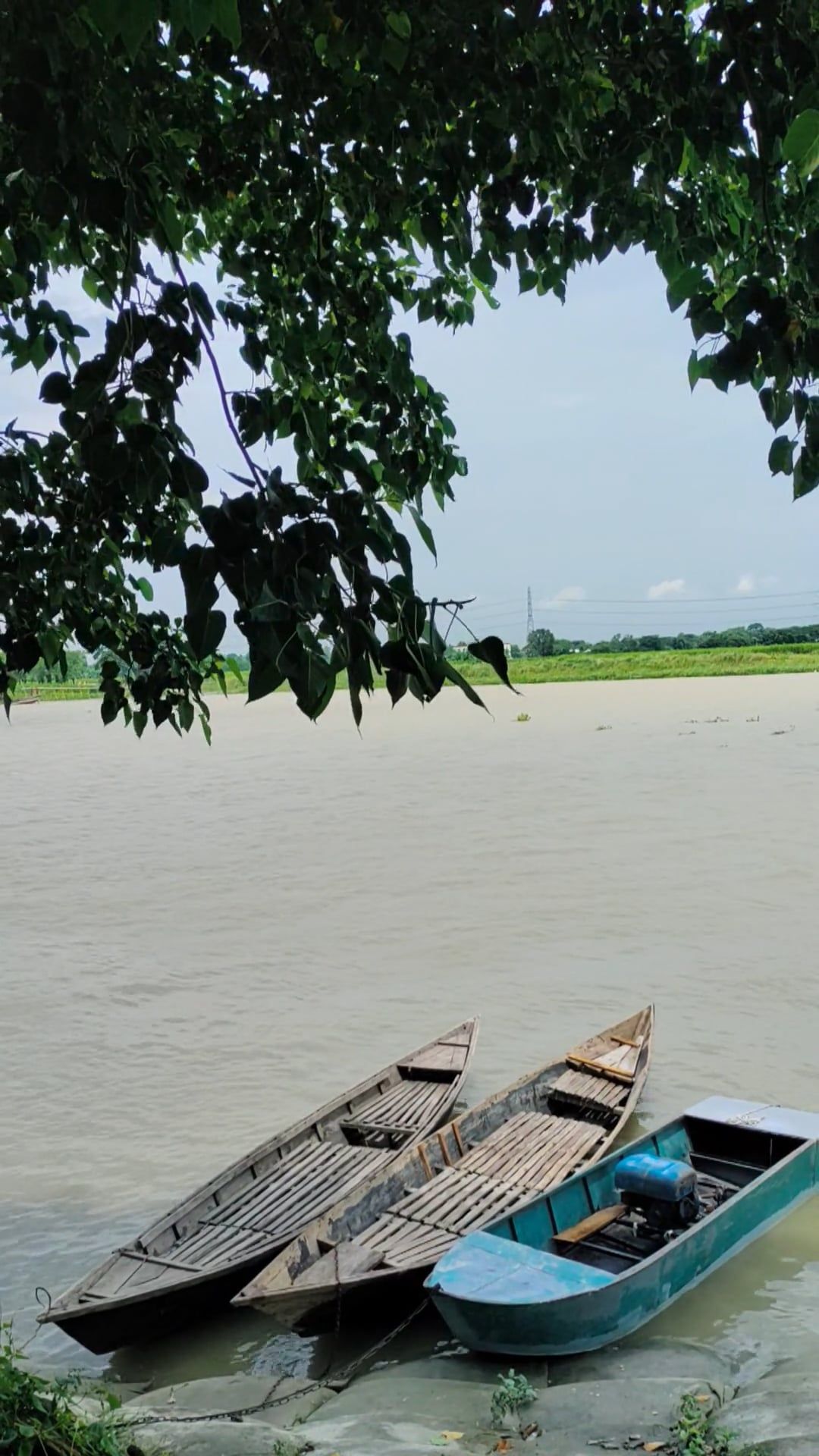 Two boats are sitting on the shore of a river Free Stock Video Footage ...