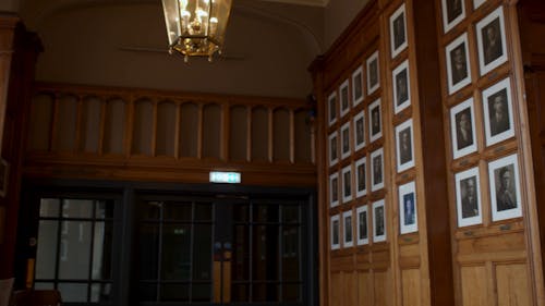 Panning shot of wall of portraits 