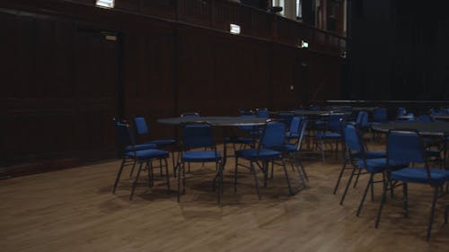 Empty stage hall with tables and chairs 