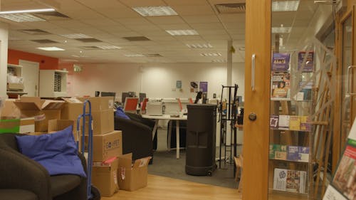 office with boxes in foreground 