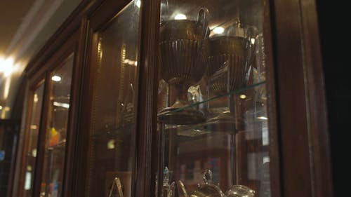 Trophy in wooden cabinet, still shot 