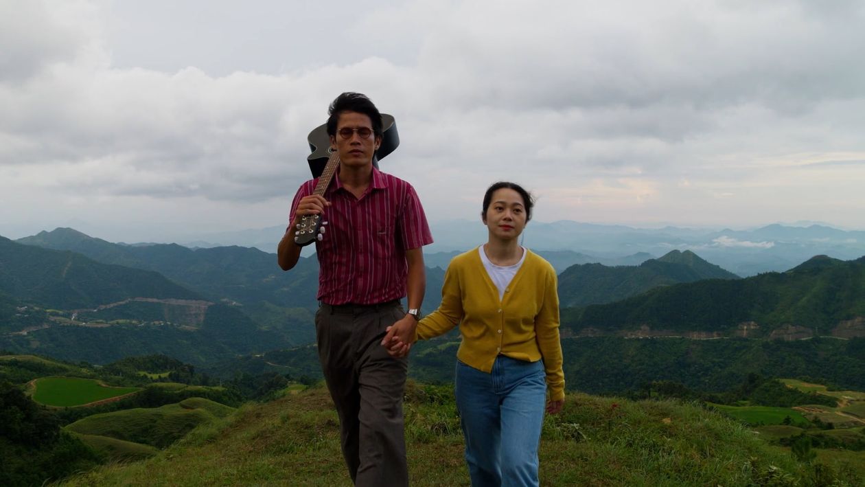 A man and woman standing on top of a mountain Free Stock Video Footage ...