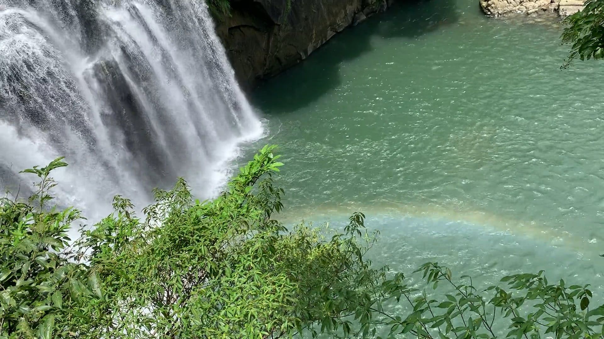 A waterfall with a rainbow in the middle of it Free Stock Video Footage ...