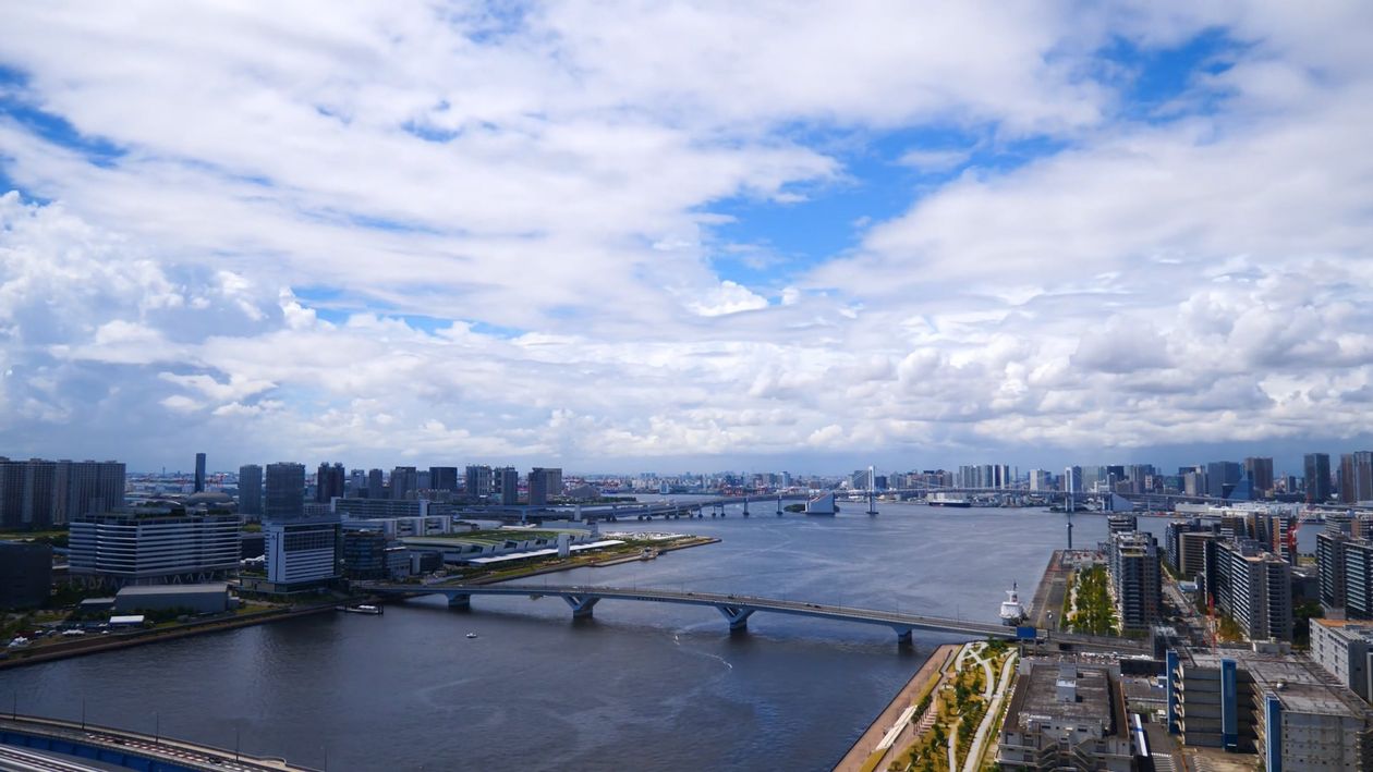 A city skyline with a river and clouds Free Stock Video Footage ...
