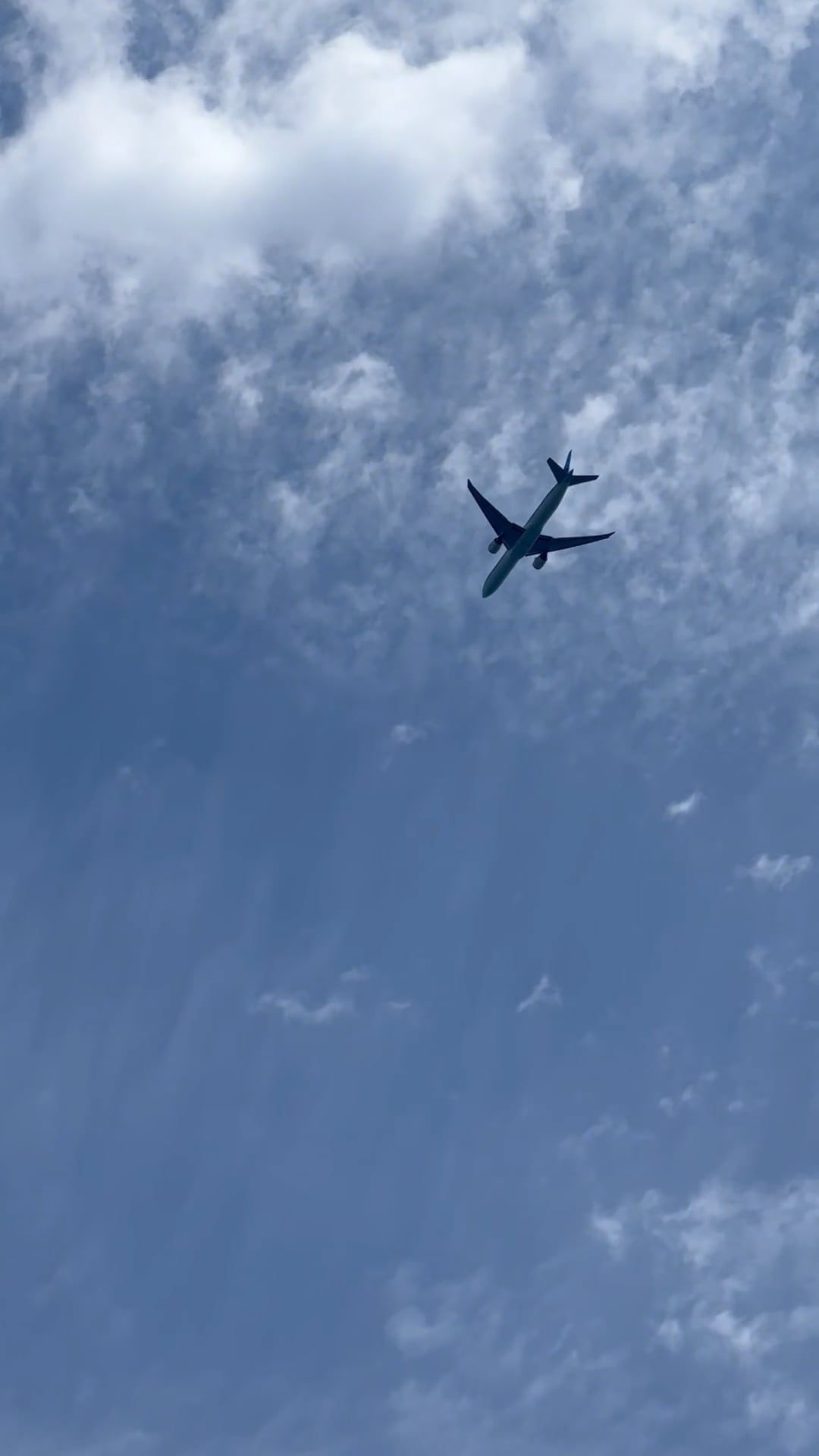 An airplane flying through the blue sky with clouds Free Stock Video ...
