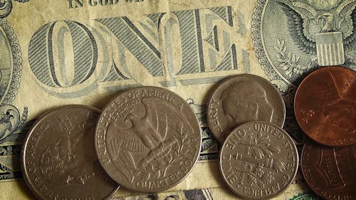 A Dollar Bill and Variety of Coins