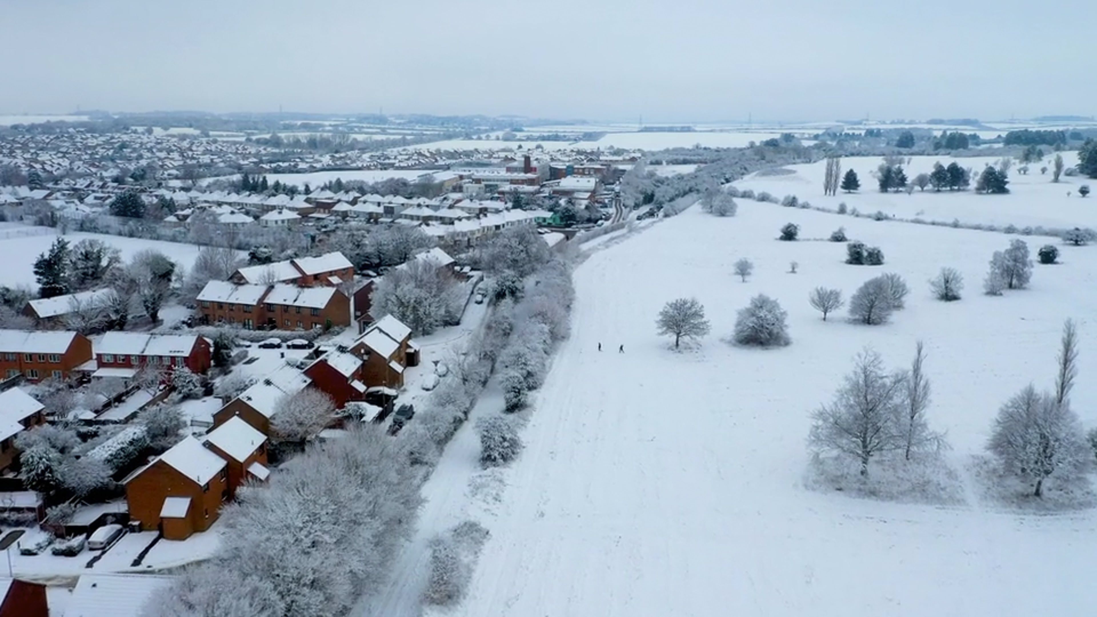 An aerial view of a snowy town with houses Free Stock Video Footage ...