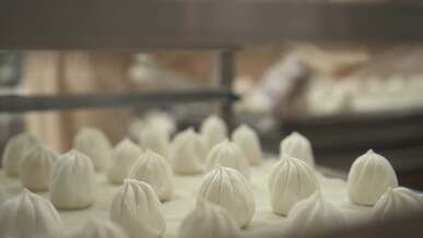 a factory with dumplings being made in the oven