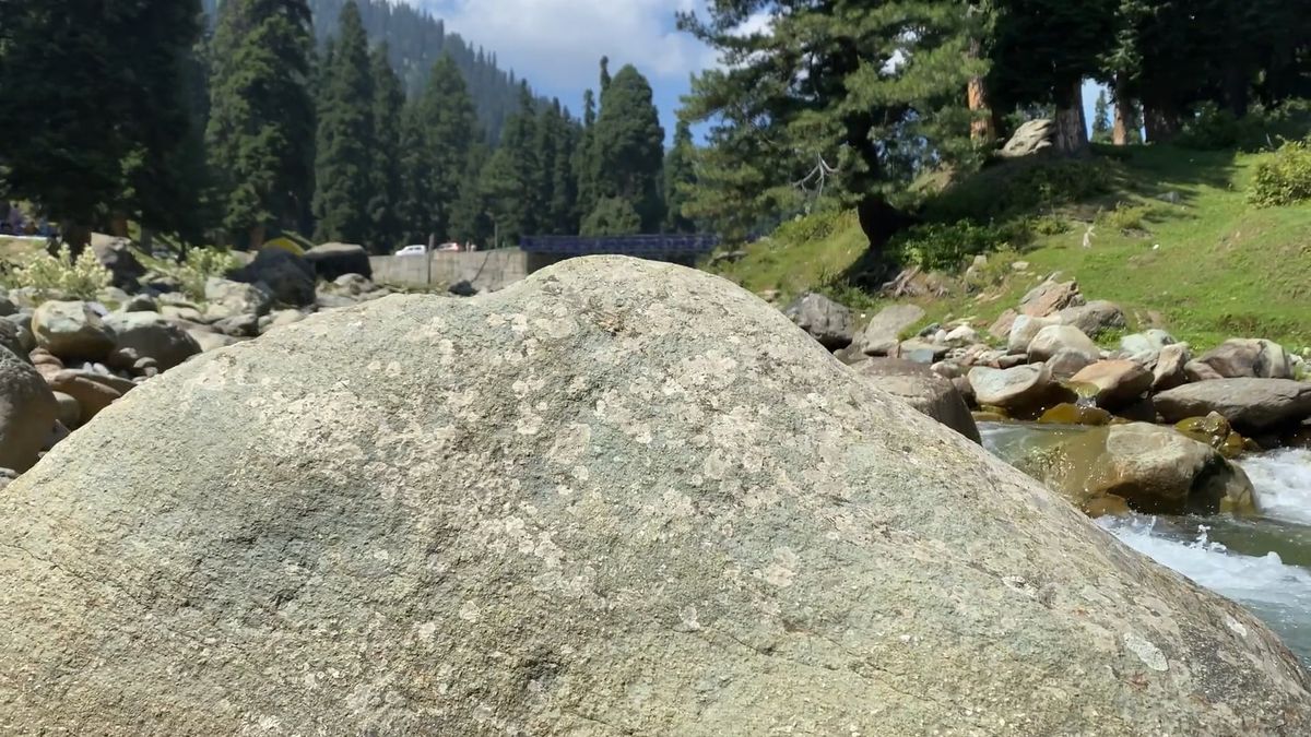Aerial View of River Flowing Beside Road & Mountain Free Stock Video ...