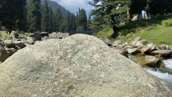 Aerial View of River Flowing Beside Road & Mountain Free Stock Video ...