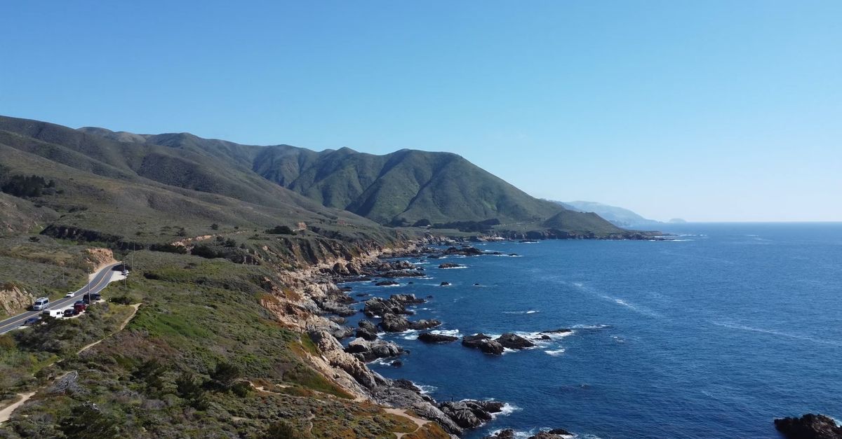 Free Direction Icon A scenic view of the ocean and mountains Free Stock Video Footage ...
