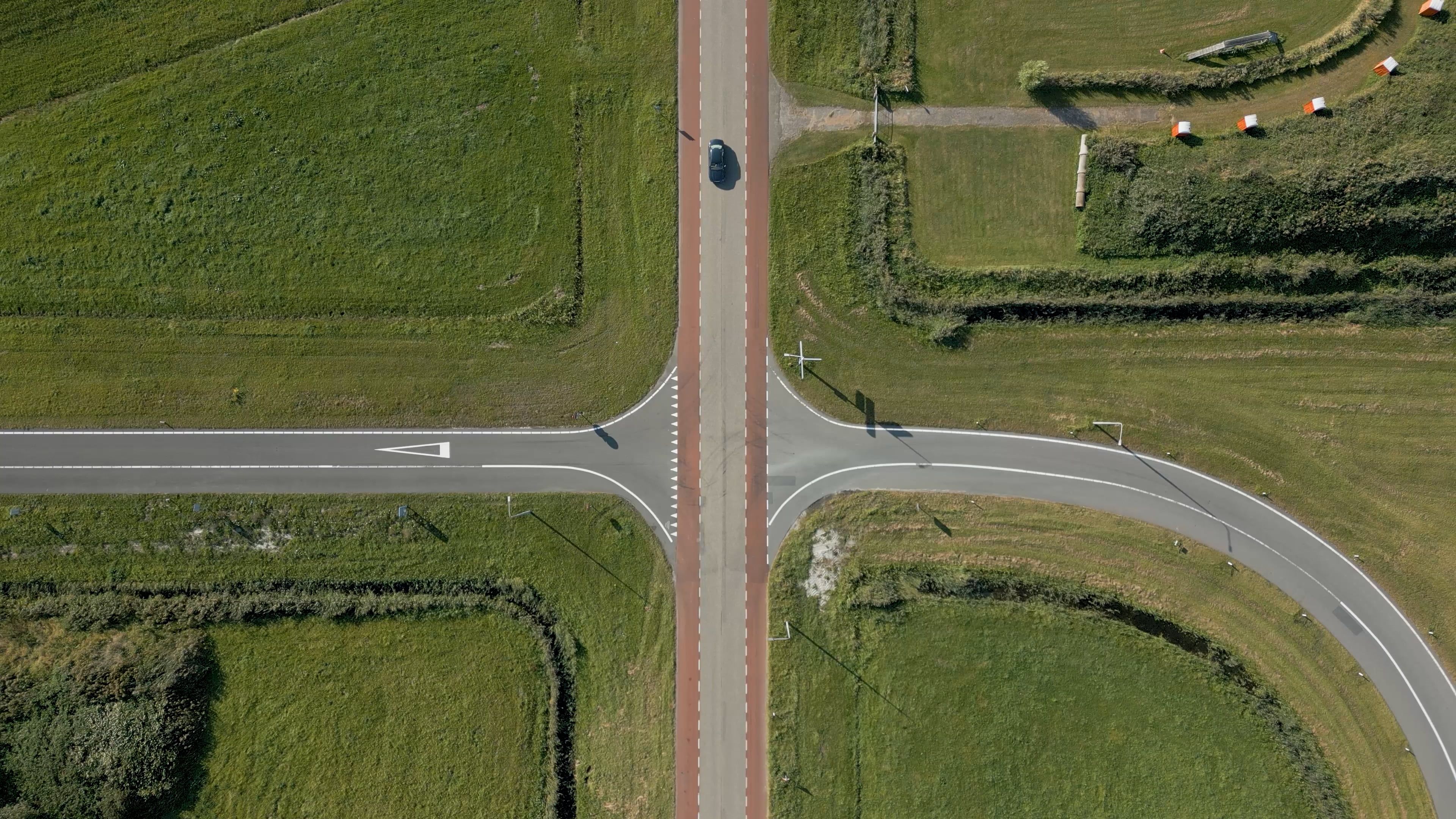 An aerial view of a road with two cross roads Free Stock Video Footage ...