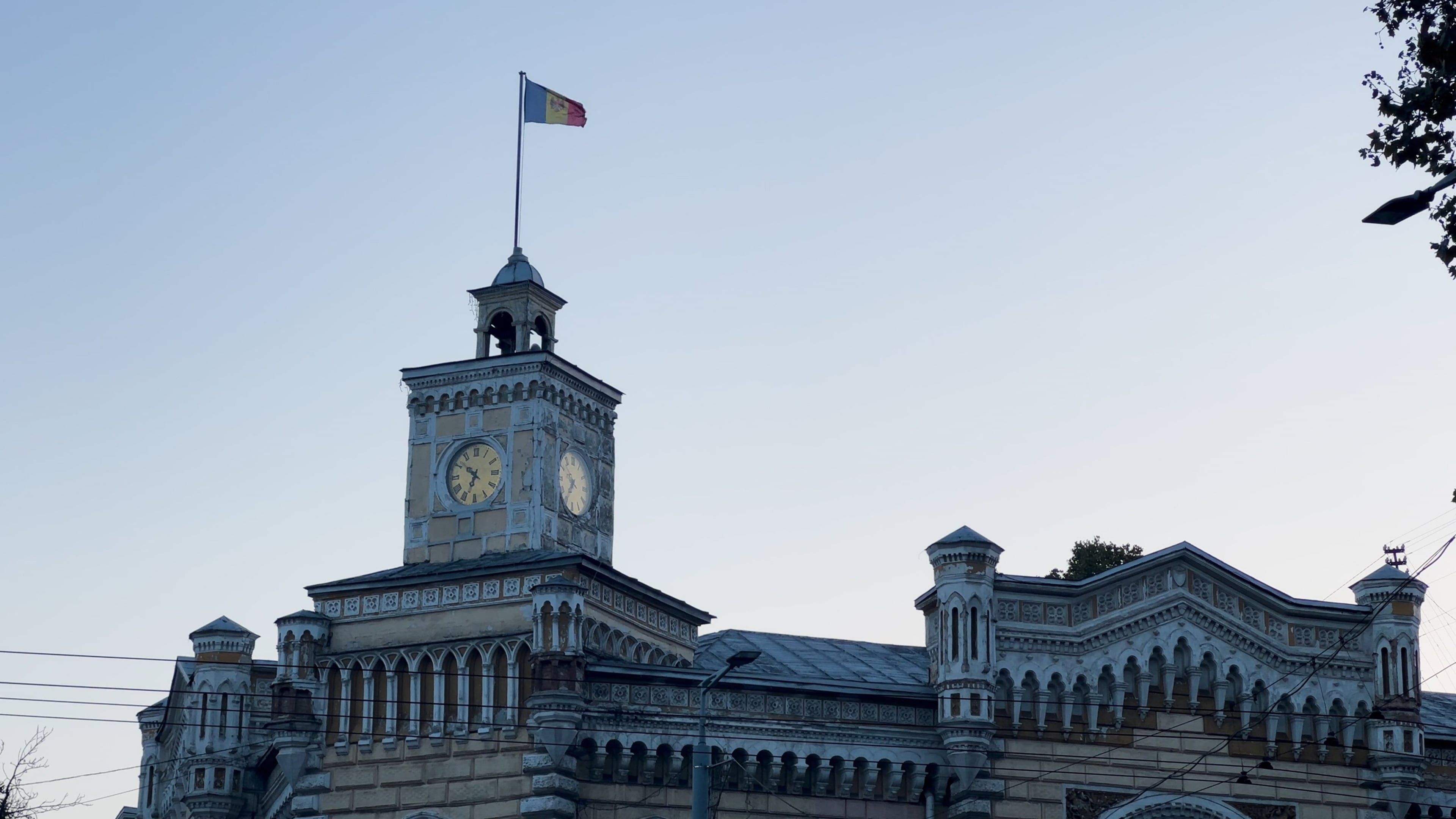 a-large-building-with-a-clock-tower-on-top-free-stock-video-footage