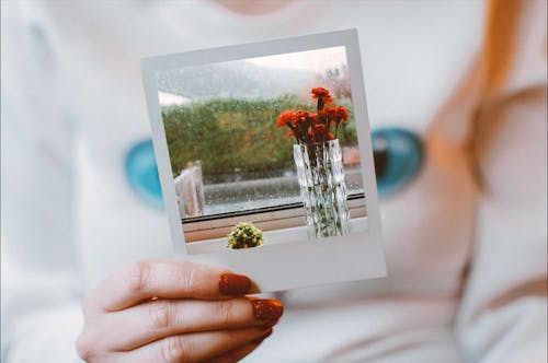 Woman Holding Polaroid