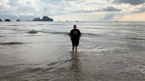 Man Checking On The Beach