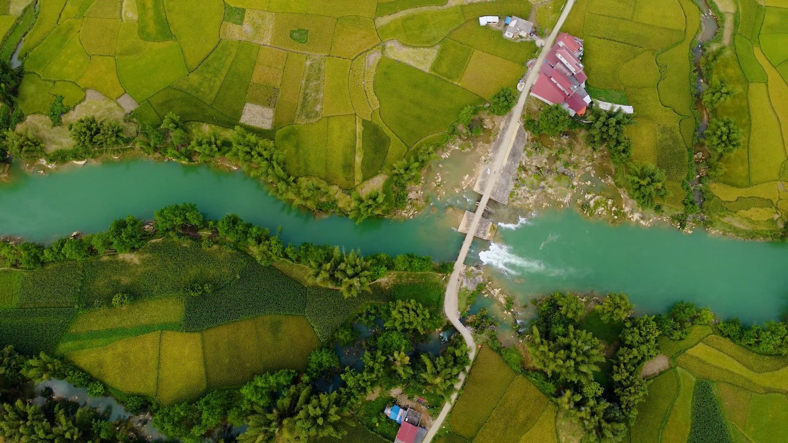 An aerial view of a river and green fields Free Stock Video Footage ...