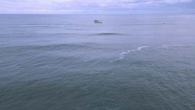 a boat is in the ocean with waves