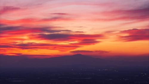 Crimson Sunset over City