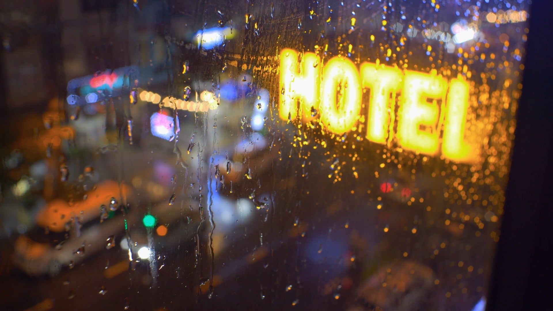 A hotel sign is seen through the rain on a rainy night Free Stock Video ...
