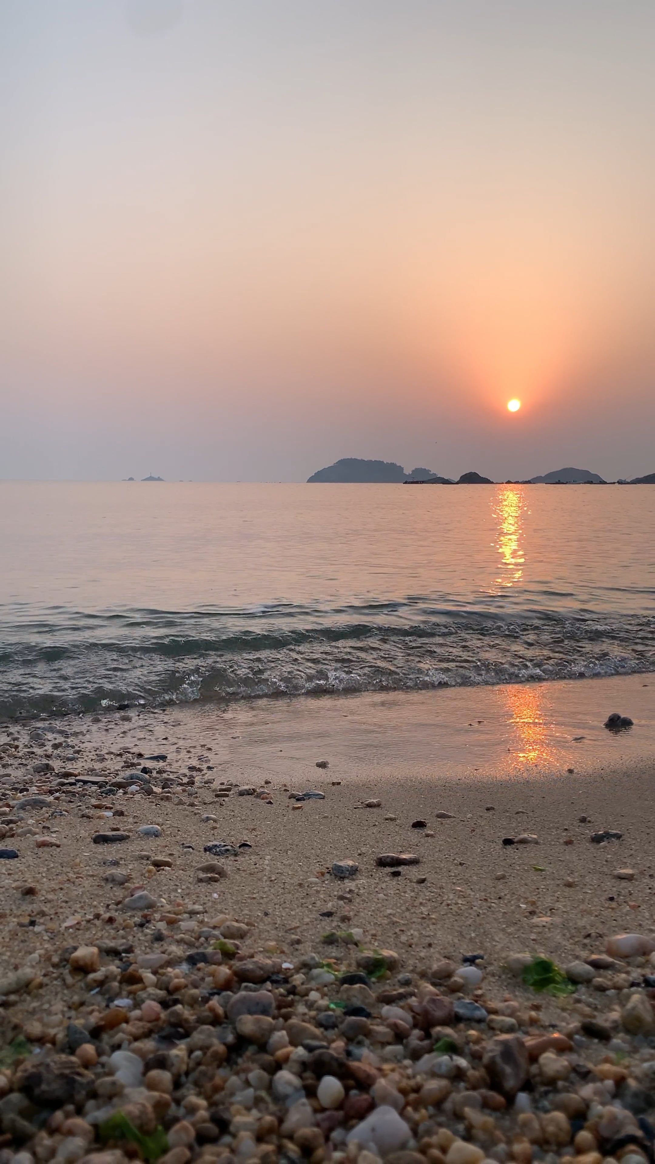 A sunset on the beach with rocks and water Free Stock Video Footage ...