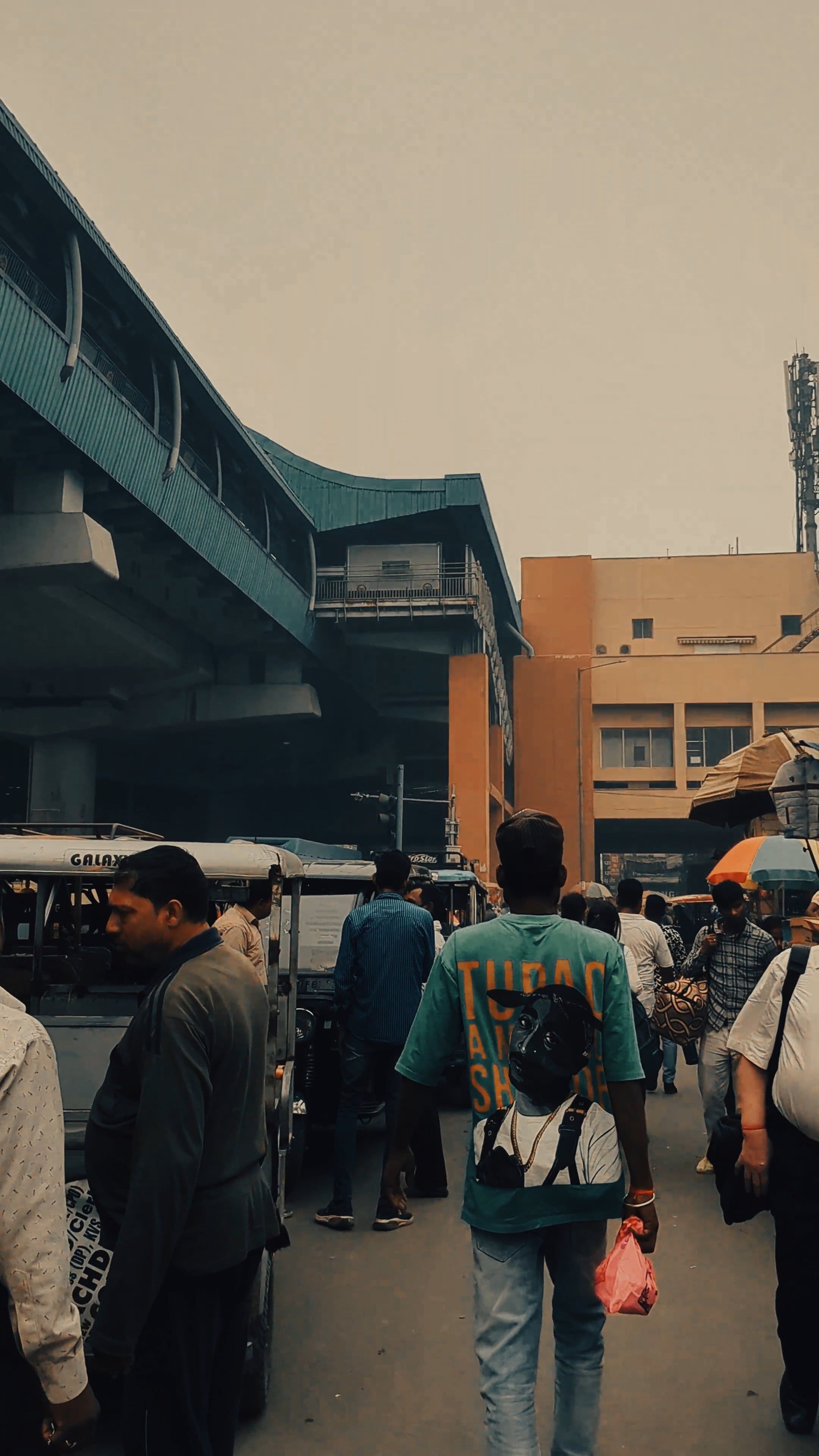 a man walking down a street with people around him 19041763 — free pexels stock footage