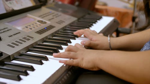 Woman Playing An Organ