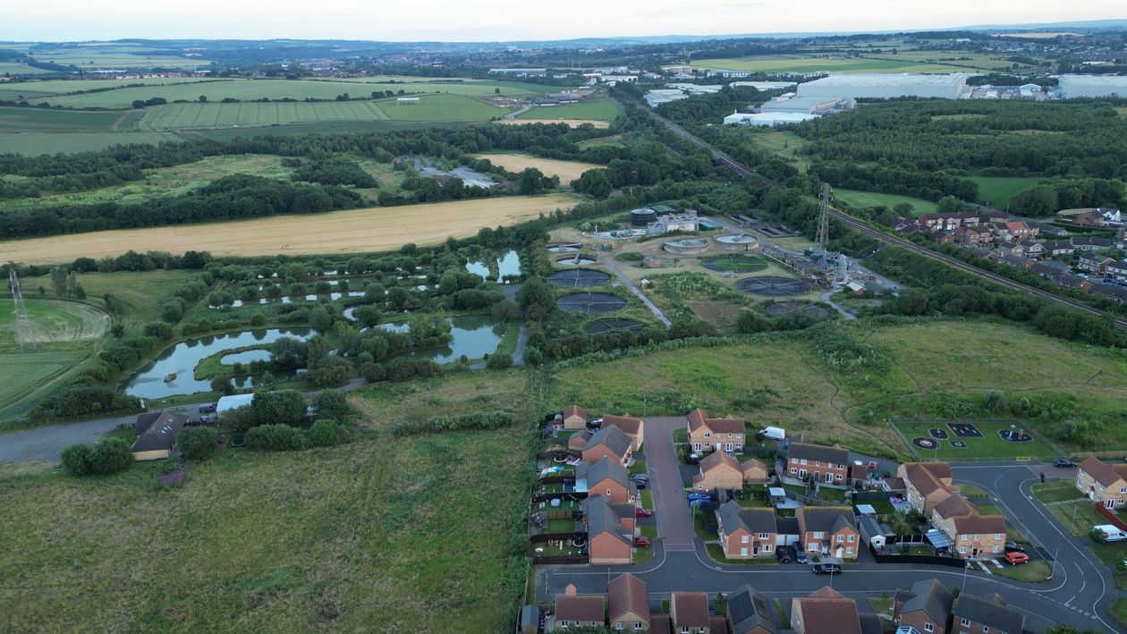 An aerial view of a large field with a river Free Stock Video Footage ...
