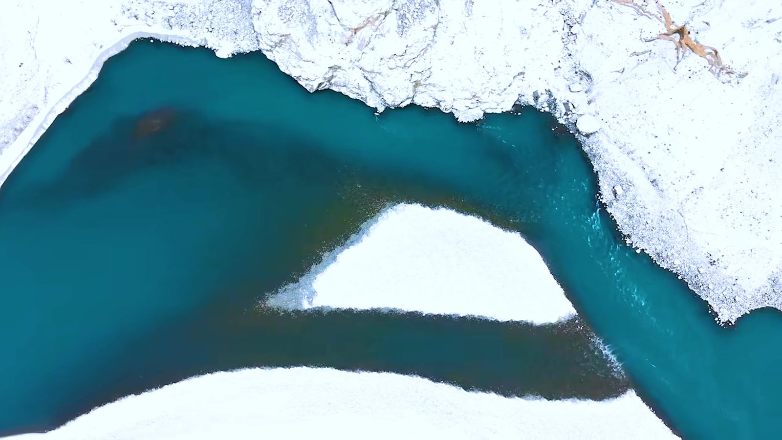 An aerial view of a lake with snow on it Free Stock Video Footage ...