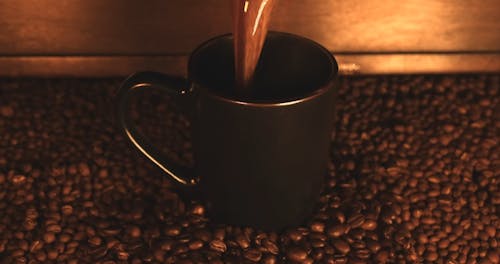 Fresh Coffee Being Poured In Slow Motion In Mug