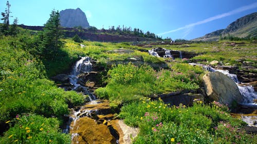 Glacier Waterfalls In Alpine Mountains